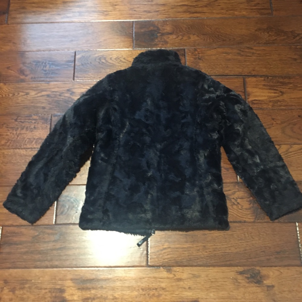 Black reversible medium size North Face coat.